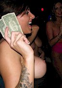 Wild and busty women party at a strip club