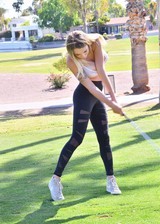 Busty blonde playing Golf