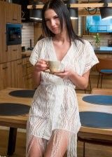 Sexy brunette has her morning coffee with a touch of hot boobs