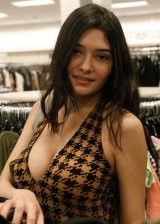 Brunette isn't shy about showing her tits in public