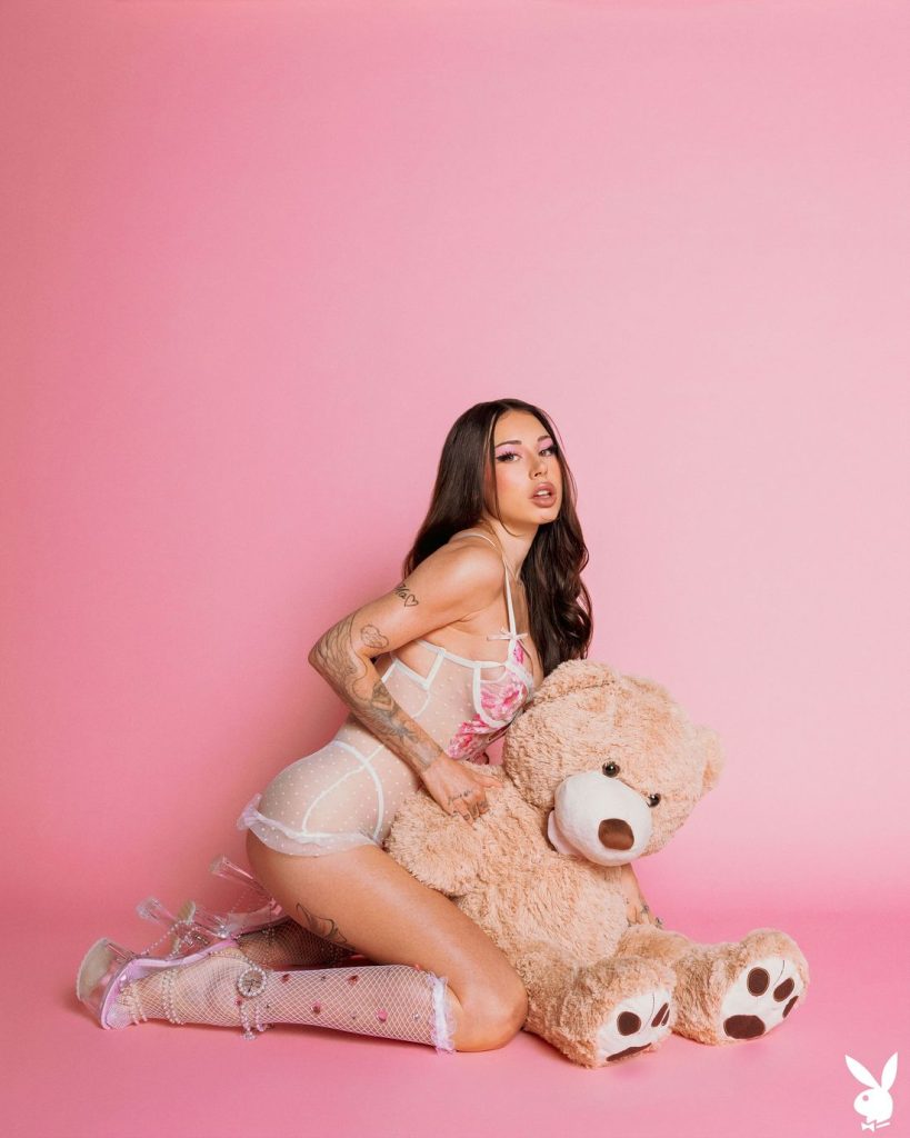 Diana Melison posing with a teddy bear