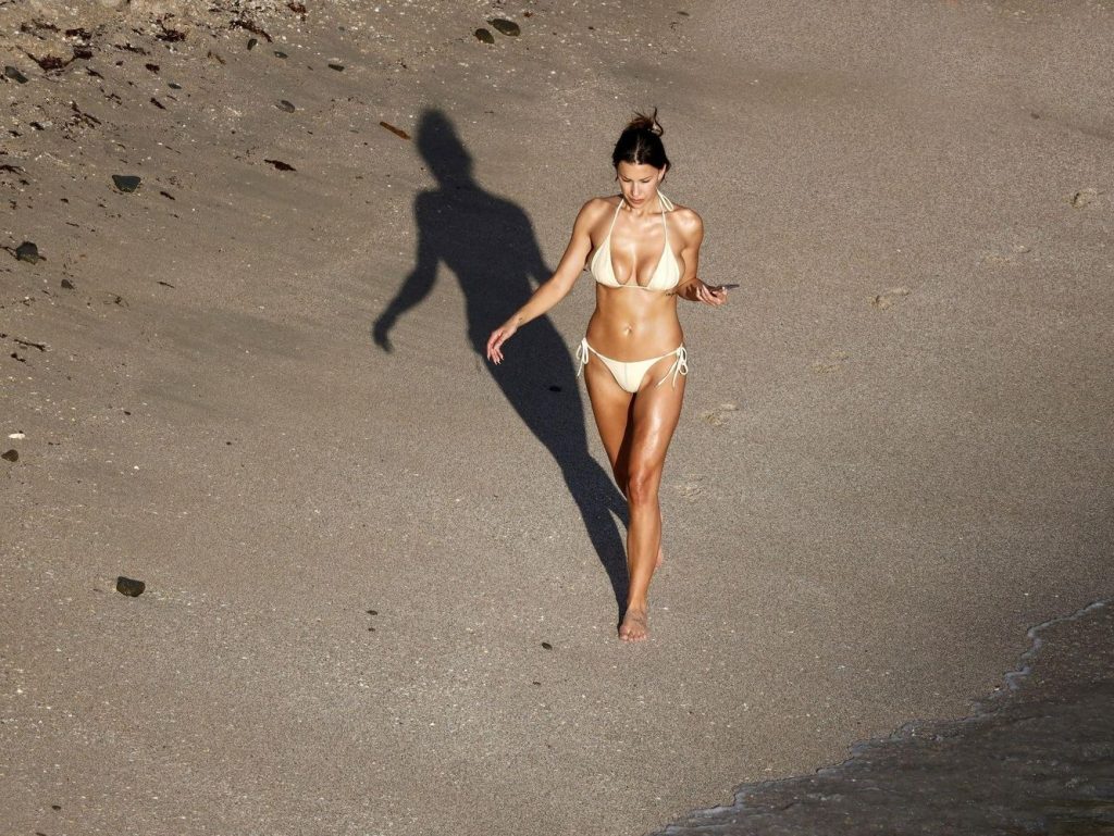 From above view of sexy Devin Brugman in a bikini at the beach